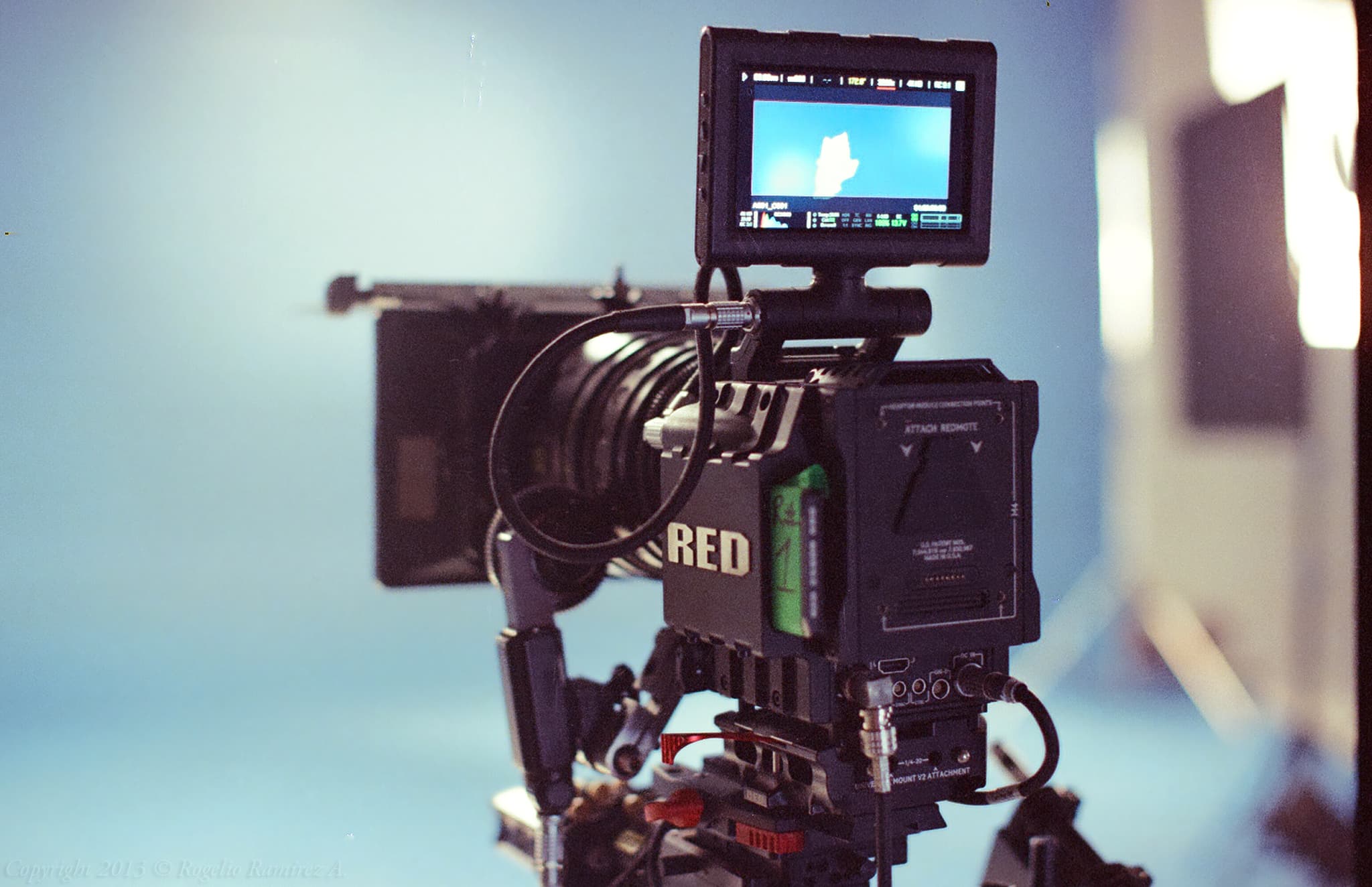 A cinema camera on set, seen from behind